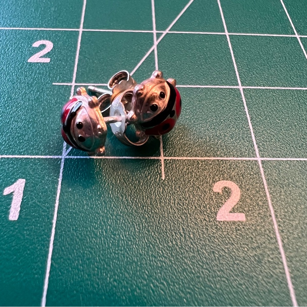 - $3 when bundled -tiny Lady bug earrings